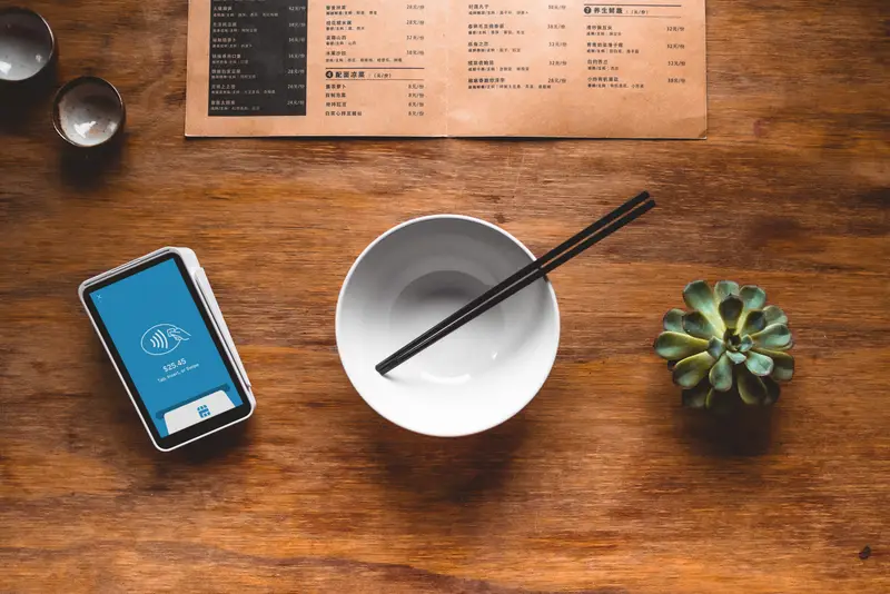 Card payment on a restaurant table